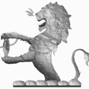 Silver lion statue holding a rugby ball