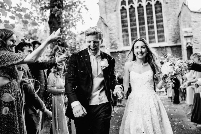 Newlyweds happily leave church wedding ceremony
