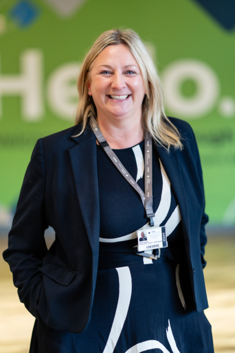 Smiling woman in business attire indoors