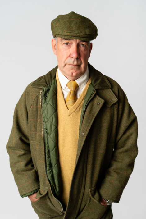 Man in green winter coat and cap