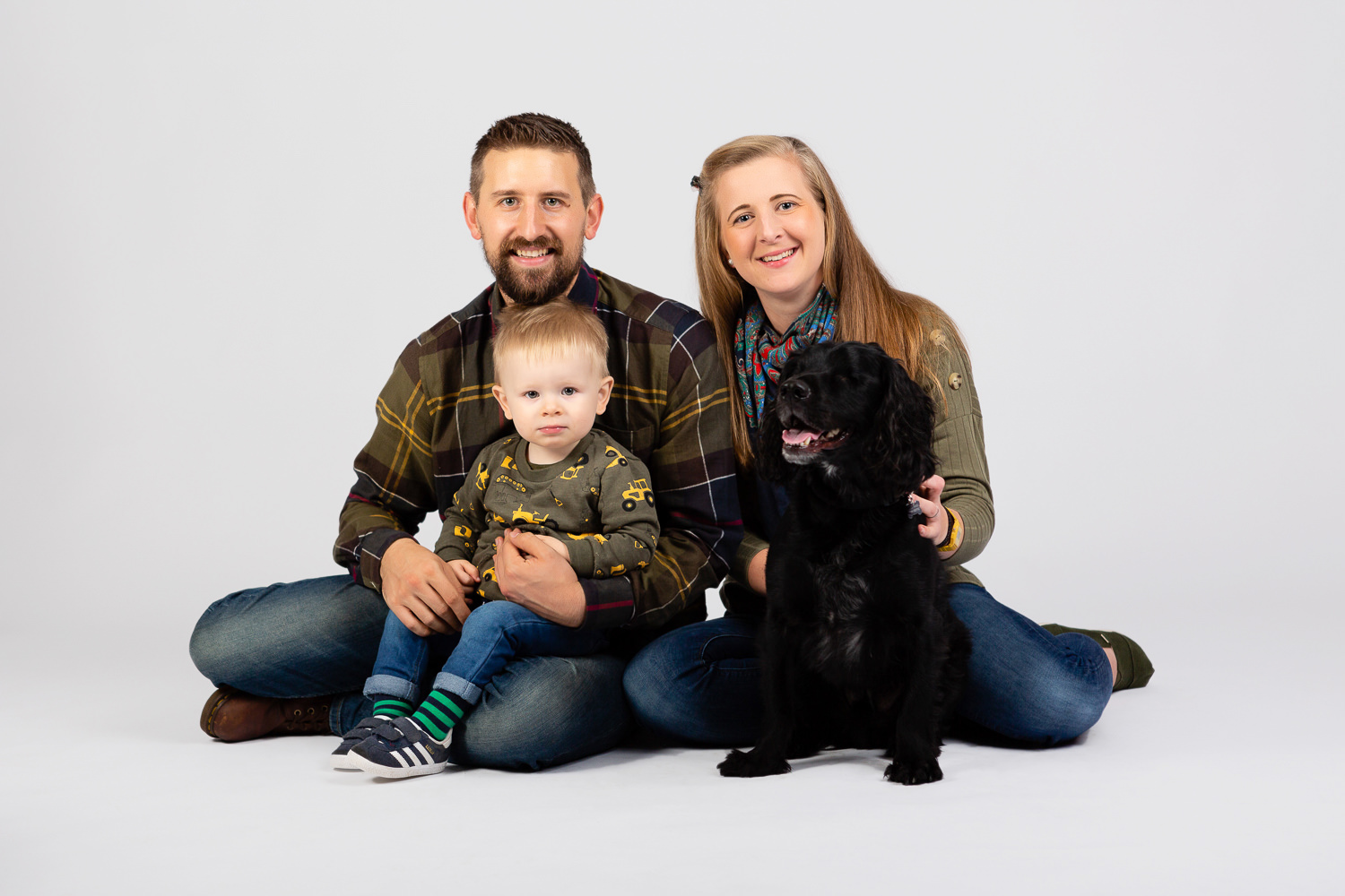Family portrait with adorable dog and toddler