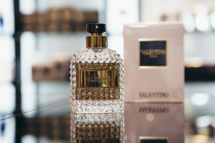 Luxury perfume bottle on reflective surface display