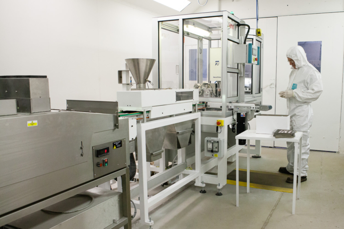 Worker in sterile pharmaceutical manufacturing facility