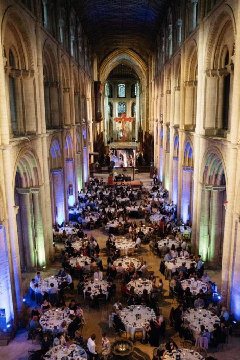 Banquet in grand cathedral hall with guests