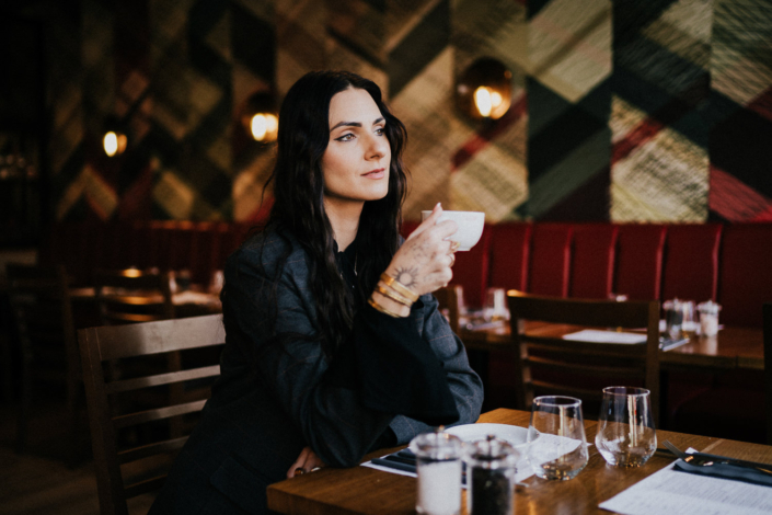 Woman enjoying coffee in a cosy cafe