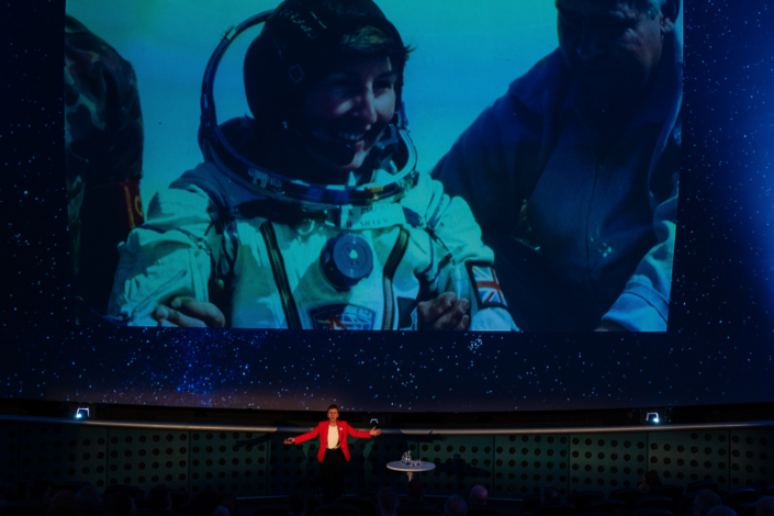 Astronaut presentation under a starry sky display