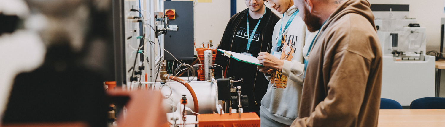 Students working in a laboratory with equipment.