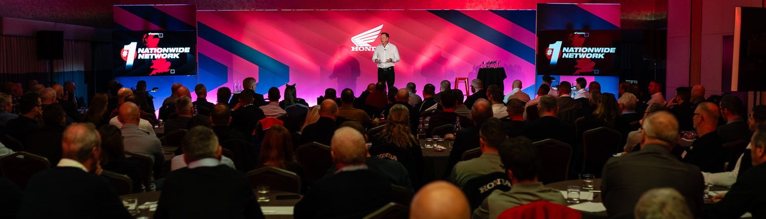 Audience attending a business conference presentation session