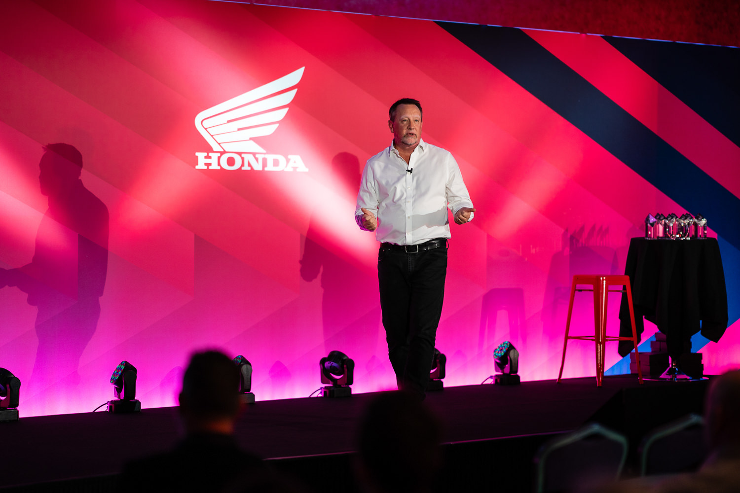 Man giving presentation at Honda themed event