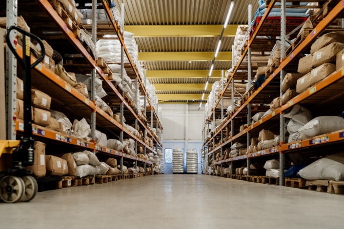 Warehouse shelves stacked with goods and supplies