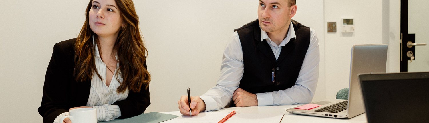 Business meeting with two professional individuals discussing