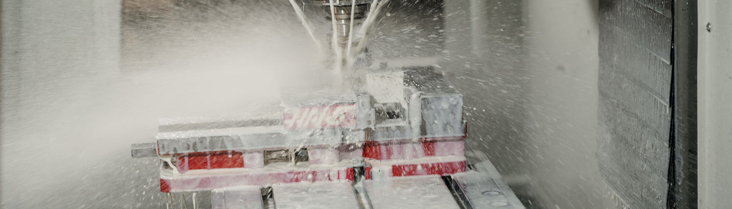 Industrial CNC machine cutting metal workpiece precisely