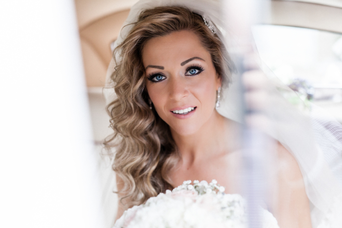 beautiful bride in wedding car photographed by peter Oliver photography